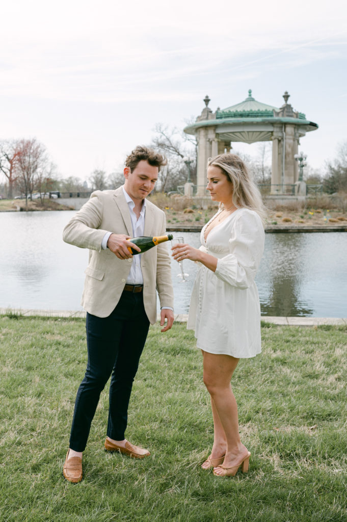 Champagne pop engagement session photos at Forest Park in St. Louis