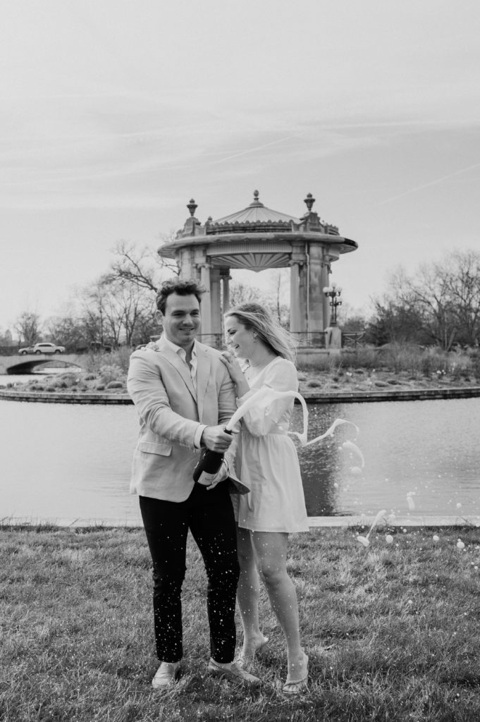 Engagement photos with champagne in Forest Park, Central West End, St. Louis