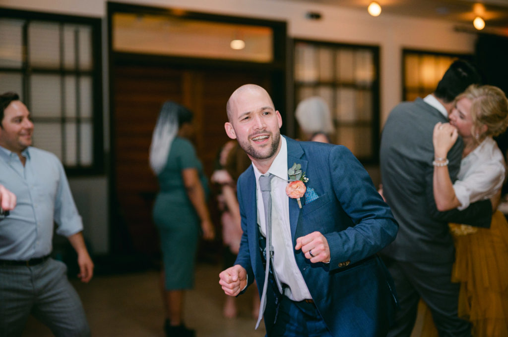 Groom dancing at his reception at Olive and Oak in St. Louis